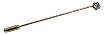 Lot 531 - A diamond set stick pin, in yellow metal...