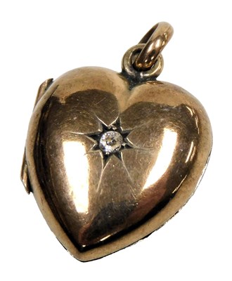 Lot 550 - A diamond set heart shaped locket, rose metal,...