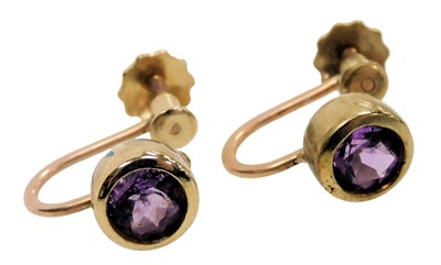 Lot 554 - A pair of amethyst single stone earrings, with...