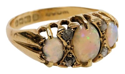 Lot 540 - An 18ct gold and opal three stone ring, set...