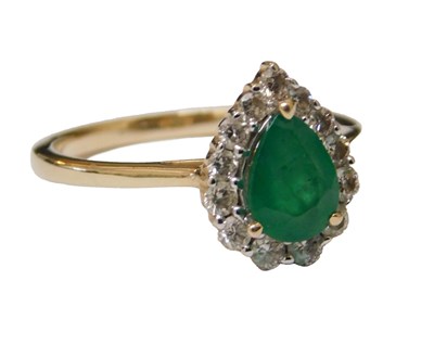 Lot 2 - An emerald and diamond ring, the tear drop...