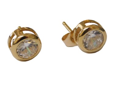 Lot 214 - A pair of CZ stud earrings, each brilliant cut...