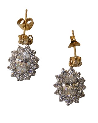 Lot 215 - A pair of white CZ oval cluster drop earrings,...