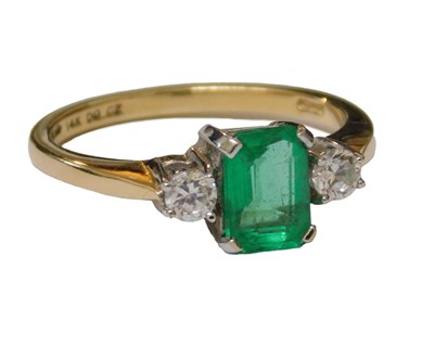 Lot 52 - A CZ and green stone ring, the central emerald...