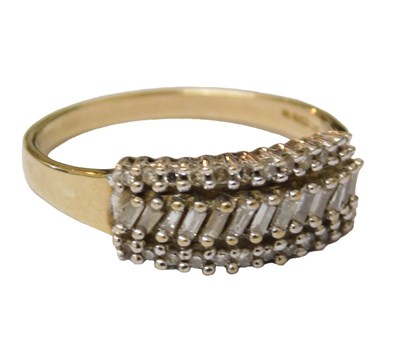 Lot 201 - A QVC 9ct gold and diamond baguette ring, set...