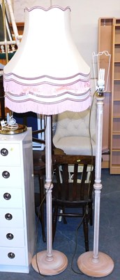 Lot 1143 - A pair of limed standard lamps, each with a...