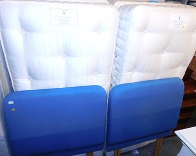 Lot 1154 - Two single beds, comprising blue upholstered...