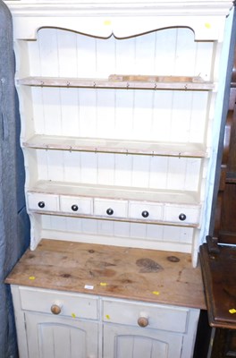 Lot 1157 - A painted pine dresser, the top with a moulded...