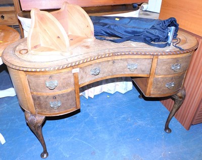 Lot 1166 - A 20thC walnut kidney shaped dressing table,...