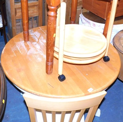 Lot 1167 - An extending kitchen table, on a painted base,...