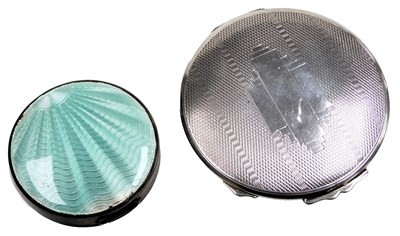 Lot 589 - A George VI circular silver compact, with...