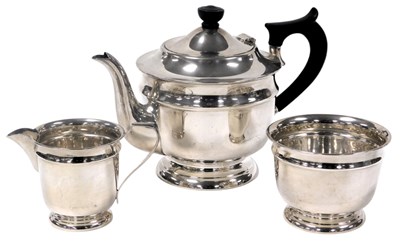 Lot 592 - A George VI silver three piece tea...