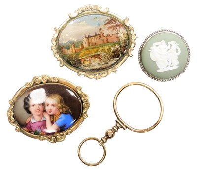 Lot 570 - A Victorian gilt metal and porcelain brooch,...