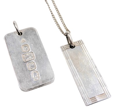 Lot 575 - A silver 1oz ingot pendant, on a ring...