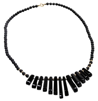Lot 576 - A jet fringe necklace, on a bolt ring clasp,...