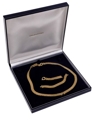 Lot 611 - A 9ct gold fringe mesh necklace, on a bolt...