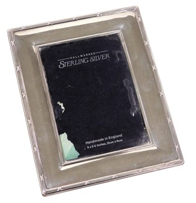 Lot 621 - An Elizabeth II silver backed strut photograph...