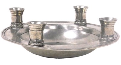 Lot 648 - A Kenneth Turner pewter dish, with four candle...