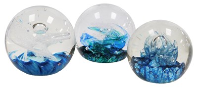 Lot 659 - Two Selkirk glass paperweights, comprising...