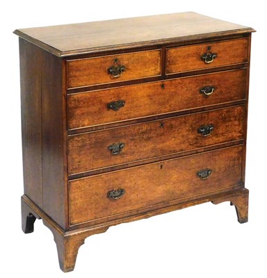 Lot 768 - A George III oak chest, of two short over...
