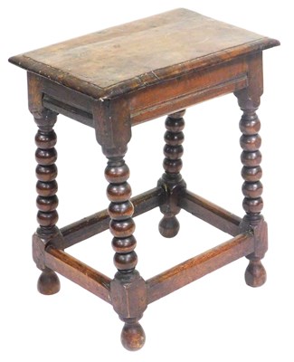 Lot 773 - An 18thC oak stool, raised on bobbin turned...