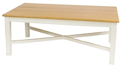 Lot 774 - A light oak and cream painted dining table,...