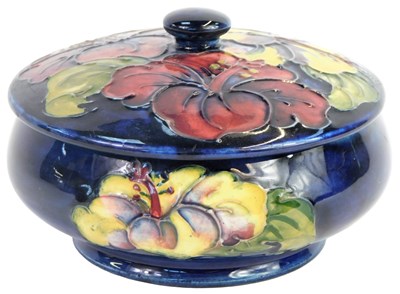 Lot 22 - A Moorcroft pottery jar and cover decorated in...