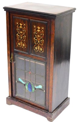 Lot 784 - A Victorian rosewood music cabinet, the triple...