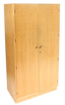Lot 687 - A Meredew light oak double wardrobe, the doors...