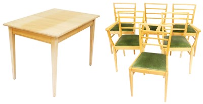 Lot 804 - A mid century light oak draw leaf dining table,...