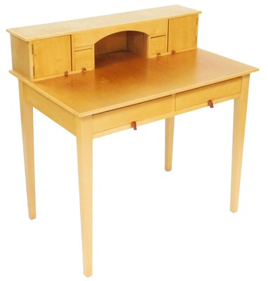 Lot 812 - A light oak lady's writing table, the rear...