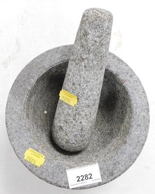 Lot 2282 - A stone pestle and mortar.