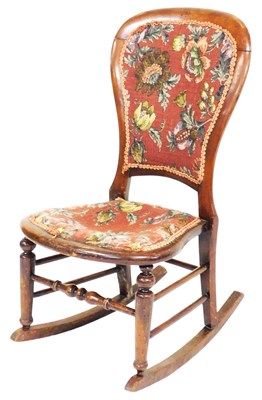 Lot 863 - A Victorian mahogany balloon back rocking...