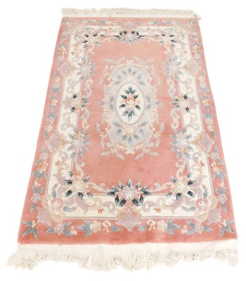 Lot 875 - A Chinese Kayam pink ground floral rug,  192cm...