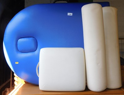 Lot 1190 - A folding massage bed in blue faux leather and...