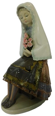 Lot 48 - A Lladro porcelain figure, modelled as a young...