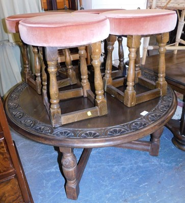 Lot 1118 - An oak low table, circular top with a carved...