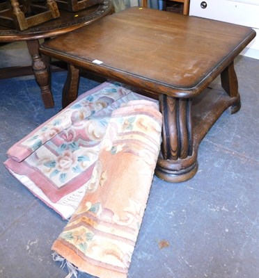 Lot 1120 - An oak coffee table, the square top with a...