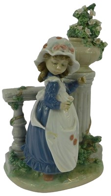 Lot 104 - A Lladro porcelain figure, modelled as a girl...