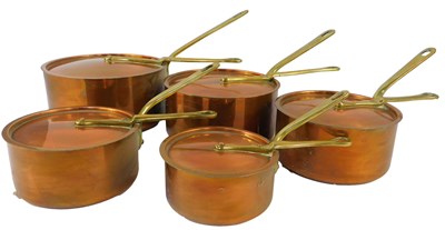 Lot 112 - A set of five copper saucepans, each with a...