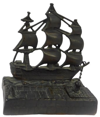 Lot 114 - A 20thC cast iron inkstand depicting HMS...