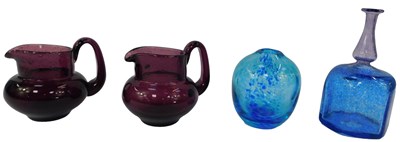 Lot 142 - Two Boda aubergine coloured glass jugs,...