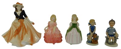 Lot 134 - A group of porcelain figures, comprising a...
