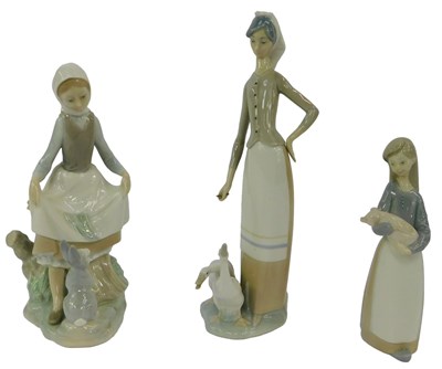 Lot 167 - Three Lladro porcelain figures, modelled as...