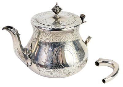 Lot 365 - A Victorian silver teapot, bright cut...