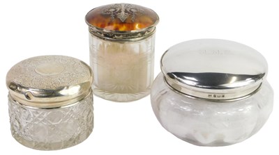 Lot 379 - A George V silver topped and glass dressing...