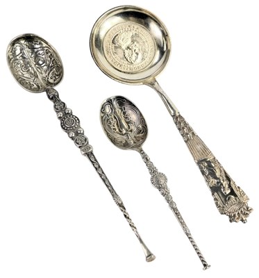 Lot 457 - Two white metal anointing spoons, 15cm long...
