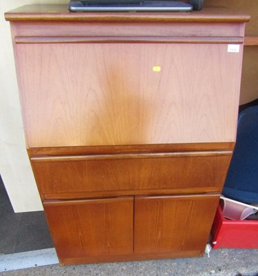 Lot 1039 - A mid 20thC teak bureau, with single drawer...
