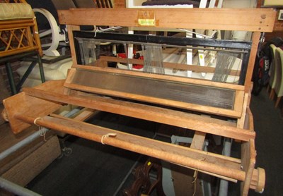 Lot 1047 - A weaving loom.