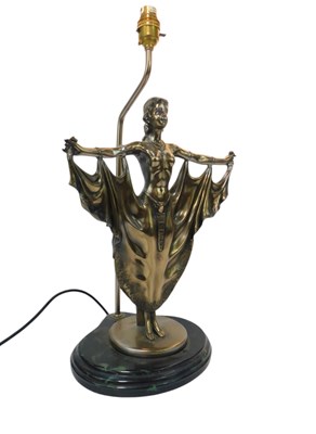 Lot 415 - A 20thC resin table lamp, in a metal finish,...